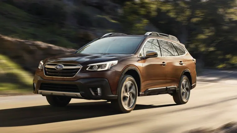 2022 Subaru Outback Touring XT driving in brown