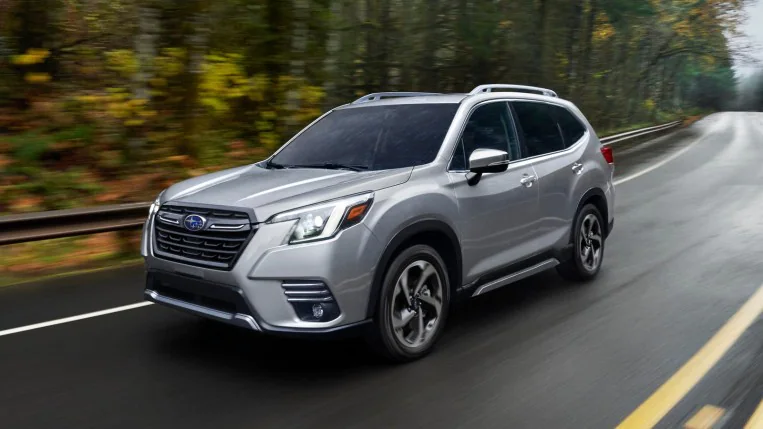 2022 Subaru Forester Touring driving near trees