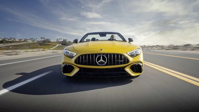 The 2022 Mercedes-AMG SL 55 in yellow, seen head-on.