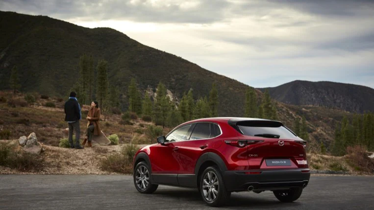The 2020 Mazda CX-30 in red from a rear quarter angle