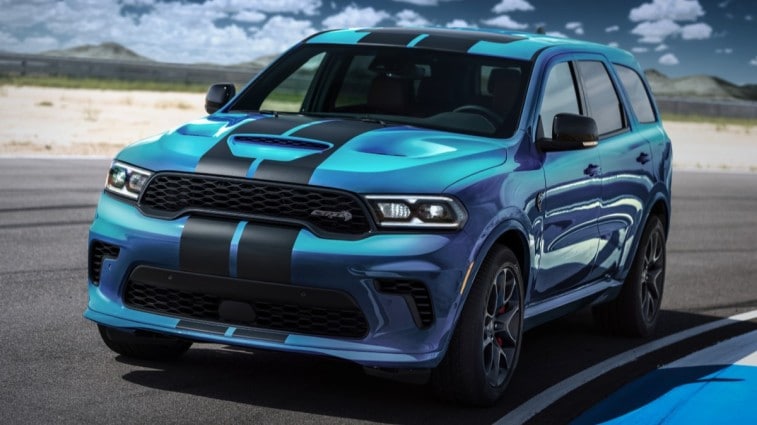 The Dodge Durango Hellcat in bright blue with black stripes, seen from a front quarter angle
