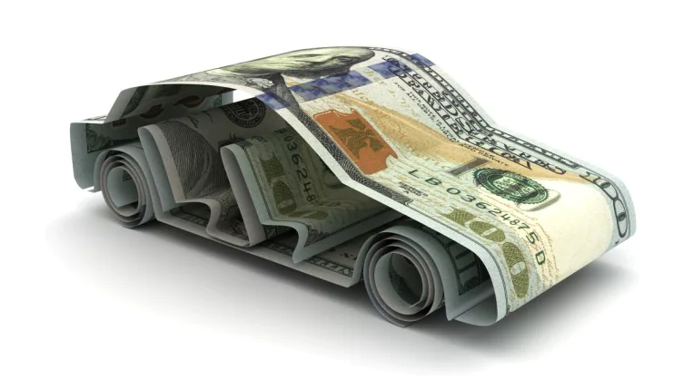 Several $100 bills folded together to resemble a car