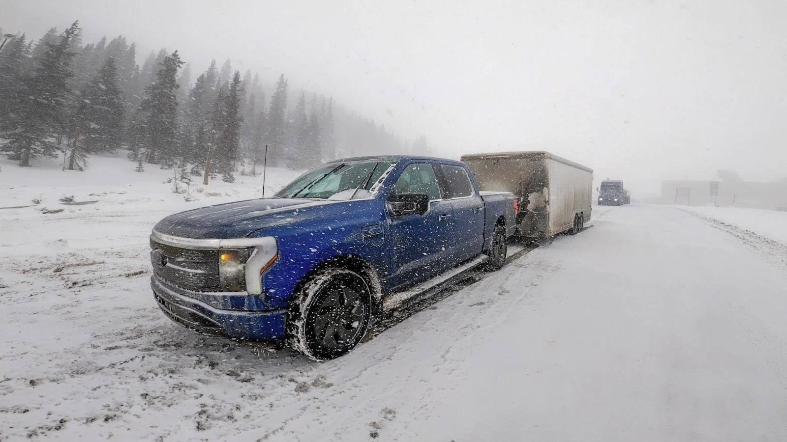F-150 Lightning towing a trailer in snow